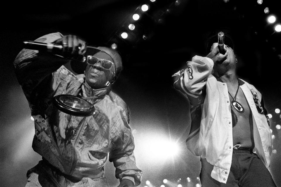 Public Enemy's Flavor Flav, left, and Chuck D perform for nearly 5,000 teens at Starwood Amphitheatre on Aug. 8, 1990.