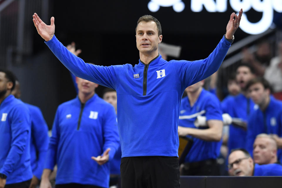 Duke head coach Jon Scheyer reacts to a call during the second half of an NCAA college basketball game against Louisville in Louisville, Ky., Tuesday, Jan. 23, 2024. Duke won 83-69. (AP Photo/Timothy D. Easley)