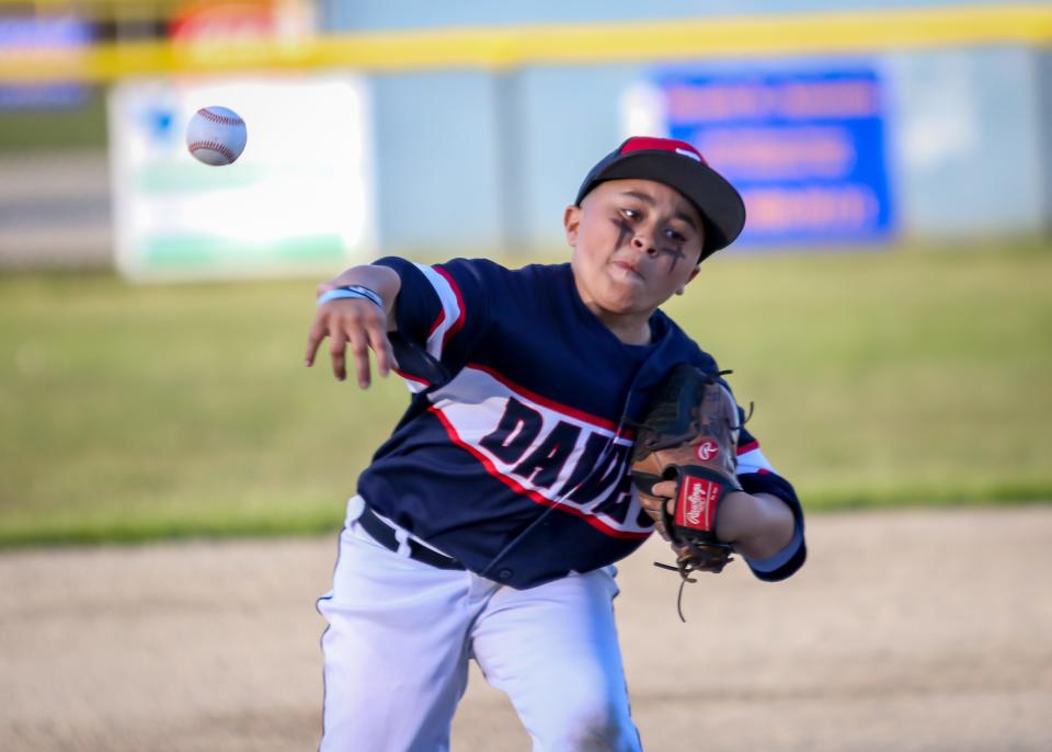 Joel Vasquez of Daves delivers during the first inning of his team's win over Table 8 on Thursday night at Whaling City Youth Baseball League.
