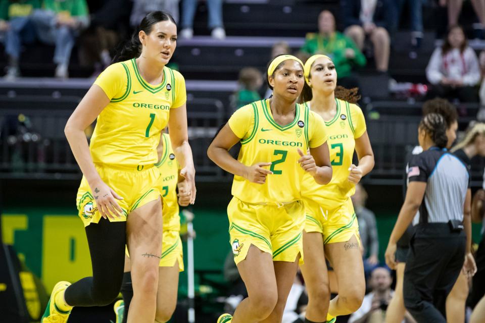 Forward Kennedy Basham, guard Chance Gray and forward Sarah Rambus jog off the court as the Oregon Ducks host No. 4 Stanford on March 2 at Matthew Knight Arena.