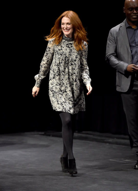 <p>Julianne Moore took to the stage to talk about her new film “Demolition” in a floral turtleneck swing dress, black tights, and black booties.</p>