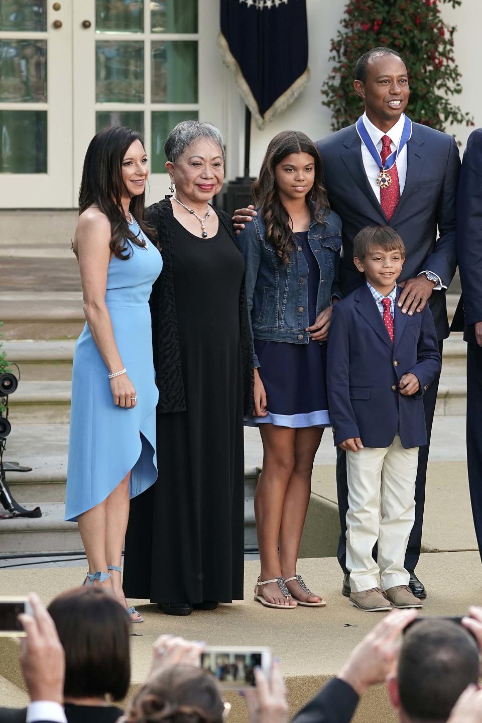 WASHINGTON, DC - MAY 06: (L-R) Erica Herman, Kultida Woods, Sam Alexis Woods, Charlie Axel Woods, Tiger Woods, U.S. President Donald Trump and first lady Melania Trump pose for photographs after Tiger Woods was presented with the Medal of Freedom during a ceremony in the Rose Garden at the White House May 06, 2019 in Washington, DC. Trump announced he would give the nation’s highest civilian honor to business partner Woods, 43, in honor of his Masters victory last month.  (Photo by Chip Somodevilla/Getty Images)