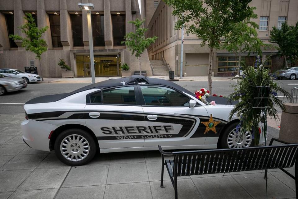 A memorial to slain Wake County Sheriffs Deputy Ned Byrd outside the Wake County Sheriffs office on Salisbury Street on Monday, August 15, 2022 in Raleigh, N.C. Deputy Byrd was found shot next to his patrol car on Thursday night August 11, 2022. Robert Willett/rwillett@newsobserver.com