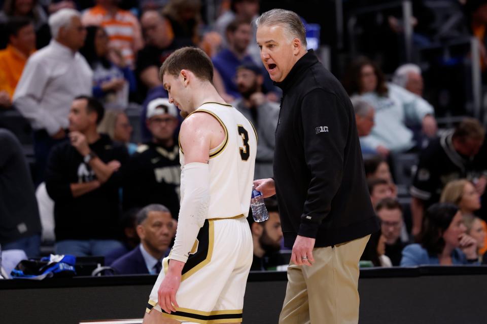 Purdue Boilermakers head coach Matt Painter talks with guard Braden Smith (3) in the first half against the Tennessee Volunteers during the NCAA Tournament Midwest Regional Championship at Little Caesars Arena in Detroit on March 31, 2024.