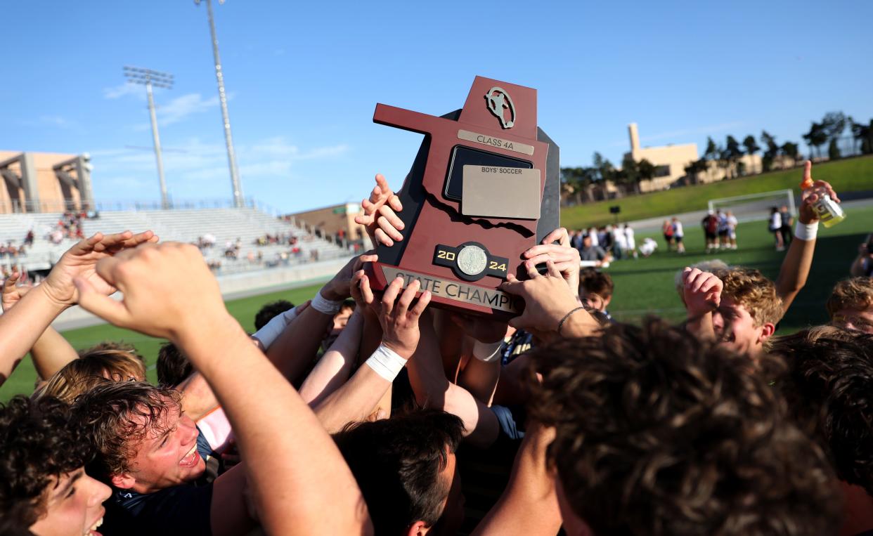 Heritage Hall celebrates the Class 4A state soccer championship game over Clinton at Taft Stadium in Oklahoma City, Friday, May, 10, 2024.