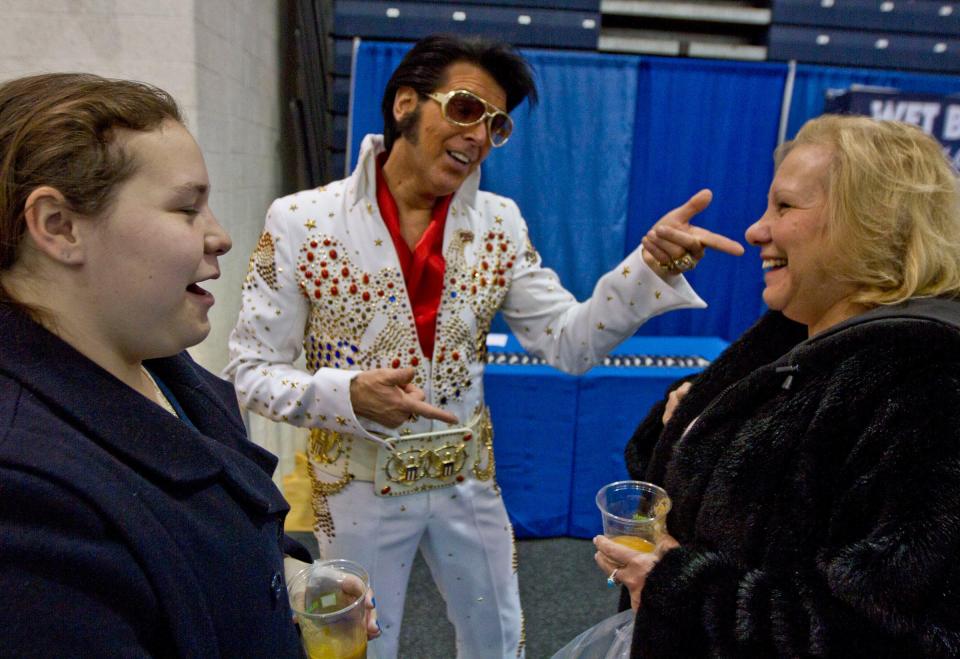 Elvis performer Richie Santa, here with Alissa and Pat Nolan, brings his King-ly show to the Villages Sunday.