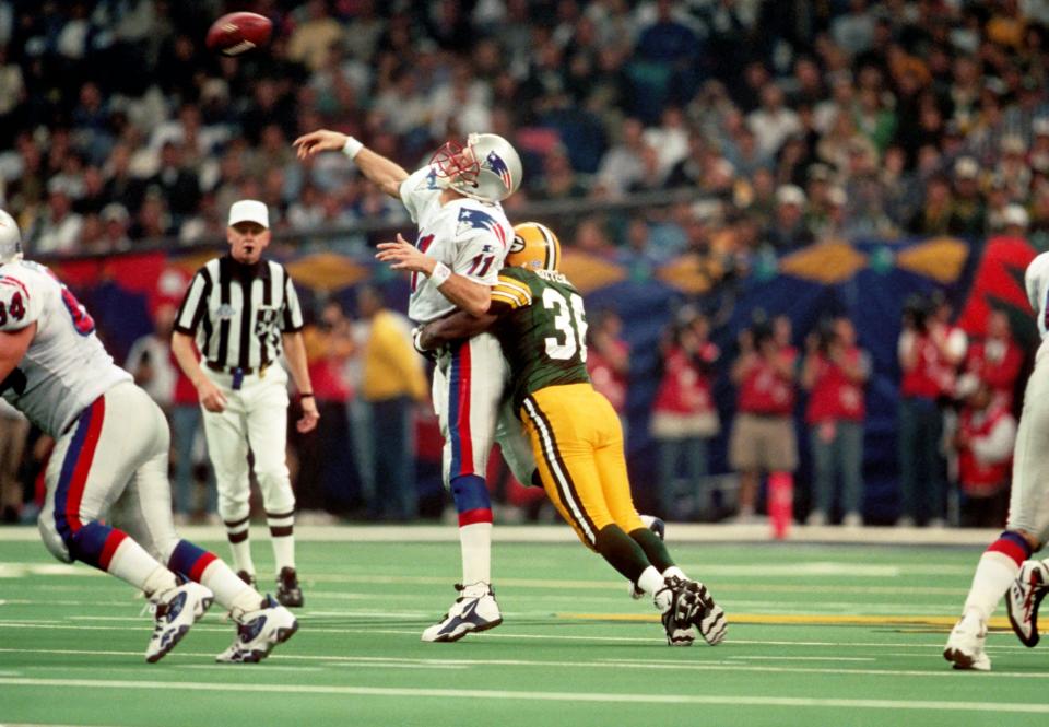 Green Bay Packers cornerback Leroy Butler hits New England Patriots quarterback Drew Bledsoe during Super Bowl XXXI at the Superdome, Jan. 26, 1997, in New Orleans. The Packers won 35-21.