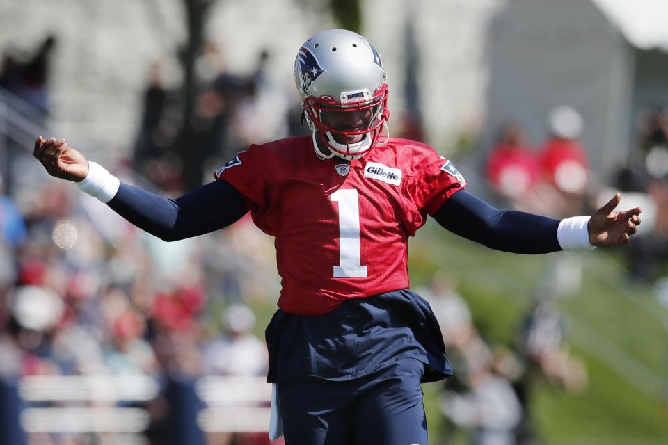 New England Patriots quarterback Cam Newton reacts during an NFL football practice, Saturday, July 31, 2021, in Foxborough, Mass. (AP Photo/Michael Dwyer)