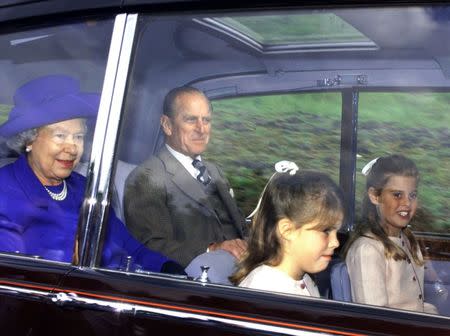 Queen Elizabeth II and Prince Phillip, accompanied by Princesses Eugenie (2ndR) and Beatrice (R) arrive at Crathie church near Balmoral for Sunday service August 30, 1998. REUTERS/Ian Waldie