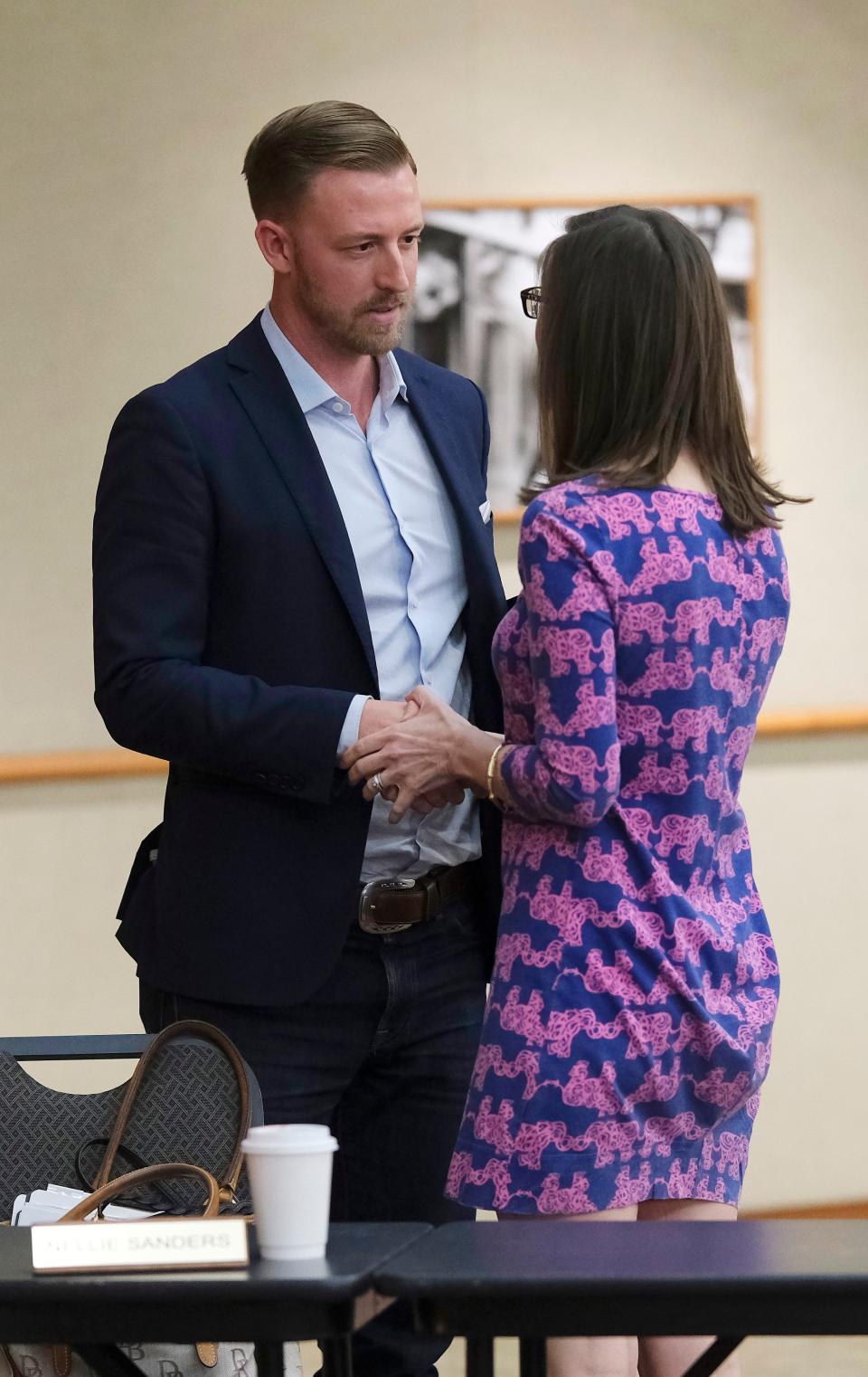 State schools Supt. Ryan Walters speaks to Nellie Sanders, now Oklahoma's Secretary of Education, after a meeting of the Oklahoma Statewide Virtual Charter School Board last year.