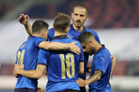 Italy's Nicola Barella, center, celebrates with his teammates after scoring his side's second goal during the international friendly soccer match between Italy and Czech Republic in Bologna, Italy, Friday, June 4, 2021. (AP Photo/Antonio Calanni)