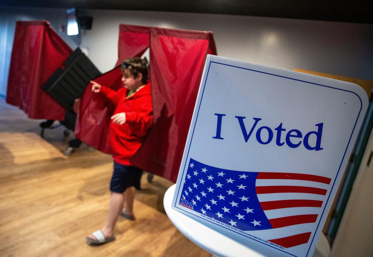 Lee Curran of Cherry Hill emerges from the voting booth after casting his vote at the Erlton Fire Company, district 25 in Cherry Hill, N.J. Tuesday, Nov. 8, 2022.