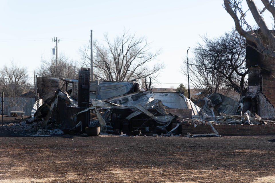 A house destroyed by the Smokehouse Creek wildfire is seen in the Scott's Acres area of Stinnett.