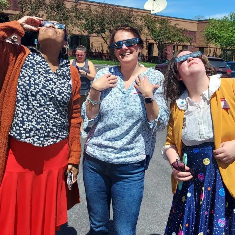 Beaver County Library System's Courtney Colaizzi and two Pennsylvania librarians at the Solar Eclipse Activities for Libraries (SEAL) training, wearing the type of eclipse glasses Beaver County libraries will distribute.