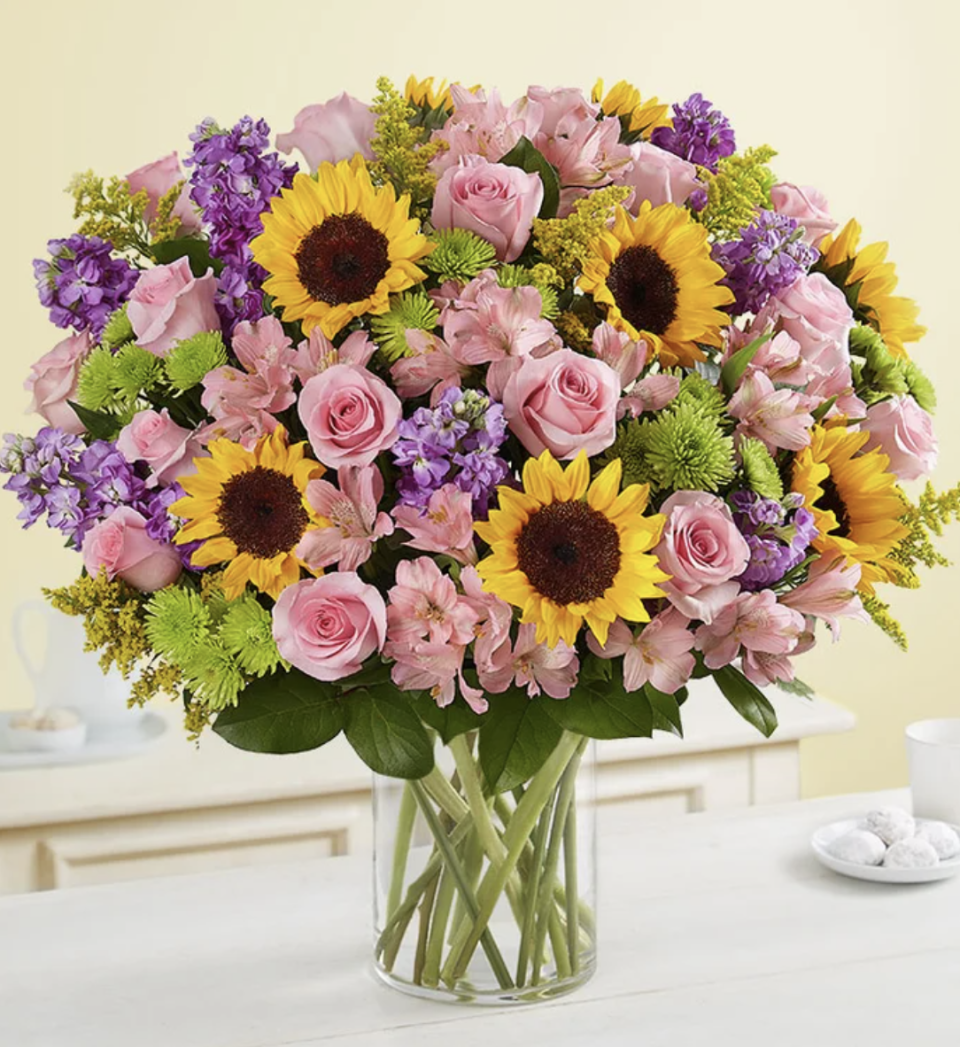 Garden of Grandeur bouquet with sunflowers and pink roses (Photo via 1-800-Flowers)