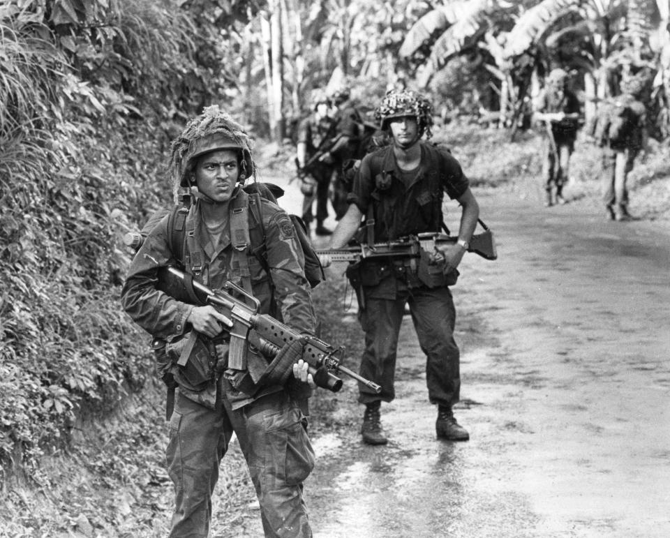 Troops of B Company 2nd Battalion,505th Parachute Infantry Regiment patrol in Grenada in November 1983.
