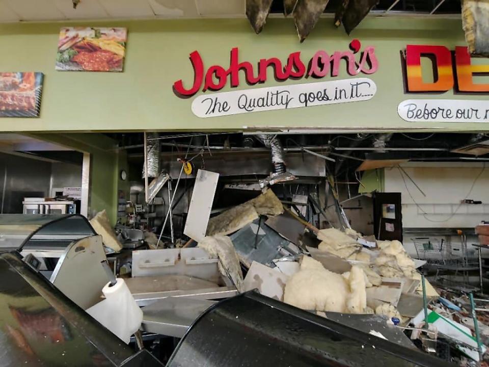 The damage to the deli area at Johnson's Giant Food in Attalla is shown after a vehicle slammed into the store's brick wall on June 5.