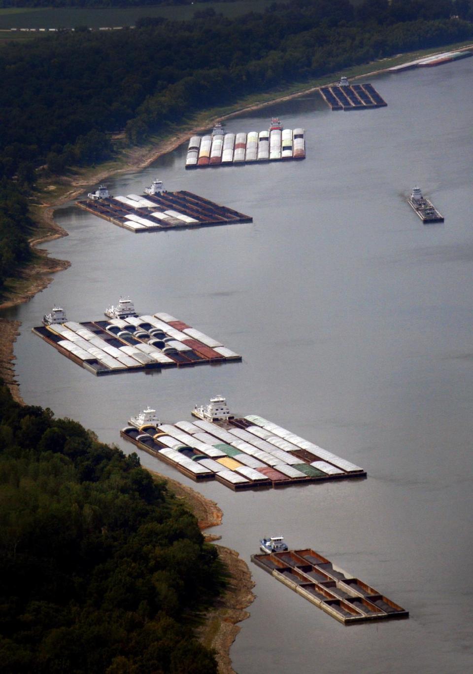 Hundreds of barges are stuck north and south of Greenville, Miss. due to low water on the Mississippi River, Tuesday, Aug. 21, 2012. Low water levels that are restricting shipping traffic, forcing harbor closures and causing barges to run aground on the economically vital Mississippi River are expected to continue into October, U.S. Army Corps of Engineers officials said Tuesday. (AP Photo/The Commercial Appeal, Alan Spearman)