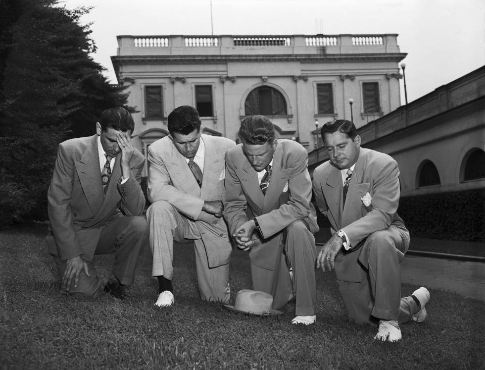 Kneeling in prayer on the White House lawn after their meeting with President Harry Truman are left to right: Jerry Beaver; Cliff Barrow; Dr. Billy Graham, and Grady Wilson. The Baptist clergymen prayed with Truman for aid in the Korean War.