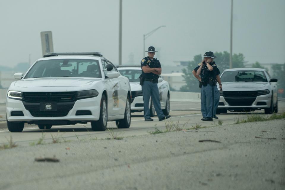 Investigators work at the scene Thursday, June 29, 2023, where Indiana State Trooper Aaron N. Smith was struck by a fleeing vehicle and killed Wednesday evening in Hendricks County.