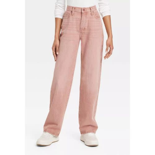 model wearing light pink target baggy jeans