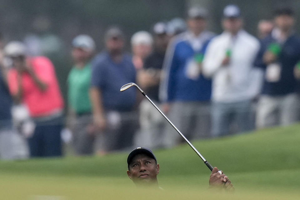 Tiger Woods hits from the third fairway during a practice for the Masters golf tournament at Augusta National Golf Club, Tuesday, April 4, 2023, in Augusta, Ga. (AP Photo/Jae C. Hong)