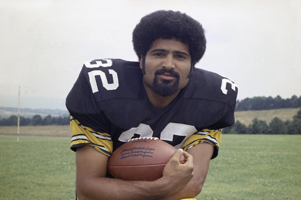 FILE - Pittsburgh Steelers running back Franco Harris is shown in 1973. Franco Harris, the Hall of Fame running back whose heads-up thinking authored “The Immaculate Reception,” considered the most iconic play in NFL history, died Wednesday, Dec. 21, 2022. He was 72. (AP Photo/Harry Cabluck, File)