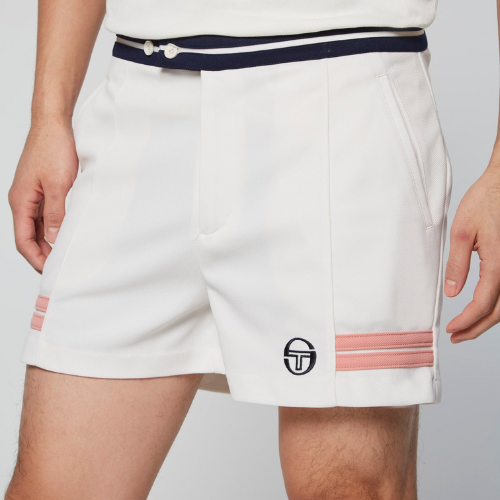 man wearing cream colored Sergio Tacchini tennis shorts