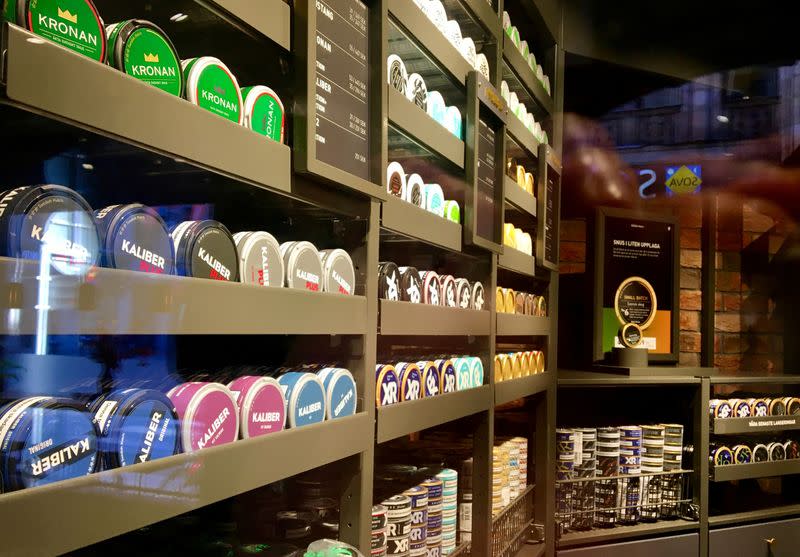 FILE PHOTO: Moist powder tobacco "snus" cans are seen on shelves at a Swedish Match store in Stockholm