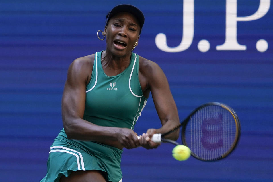 Venus Williams, of the United States, returns a shot to Alison Van Uytvanck, of Belgium, during the first round of the US Open tennis championships, Tuesday, Aug. 30, 2022, in New York. (AP Photo/Seth Wenig)