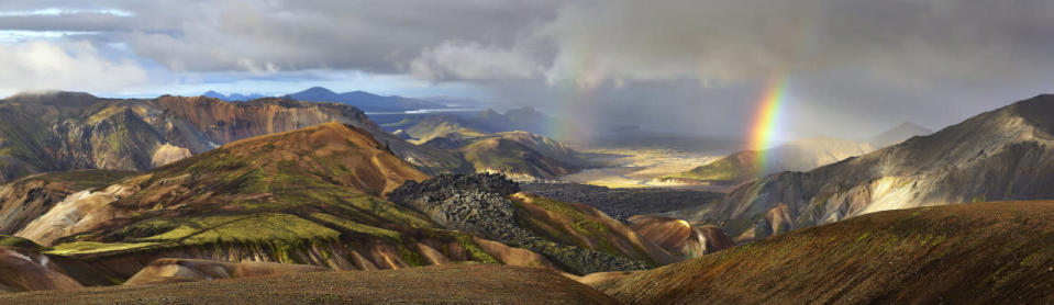 A landscape view of a rainbow appearing on Iceland’s Laugavegur trek. (Michael Fersch/Caters News Agency)