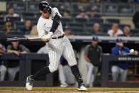 New York Yankees' Aaron Judge hits an RBI-single during the third inning of a baseball game against the Texas Rangers, Monday, Sept. 20, 2021, in New York. (AP Photo/Frank Franklin II)