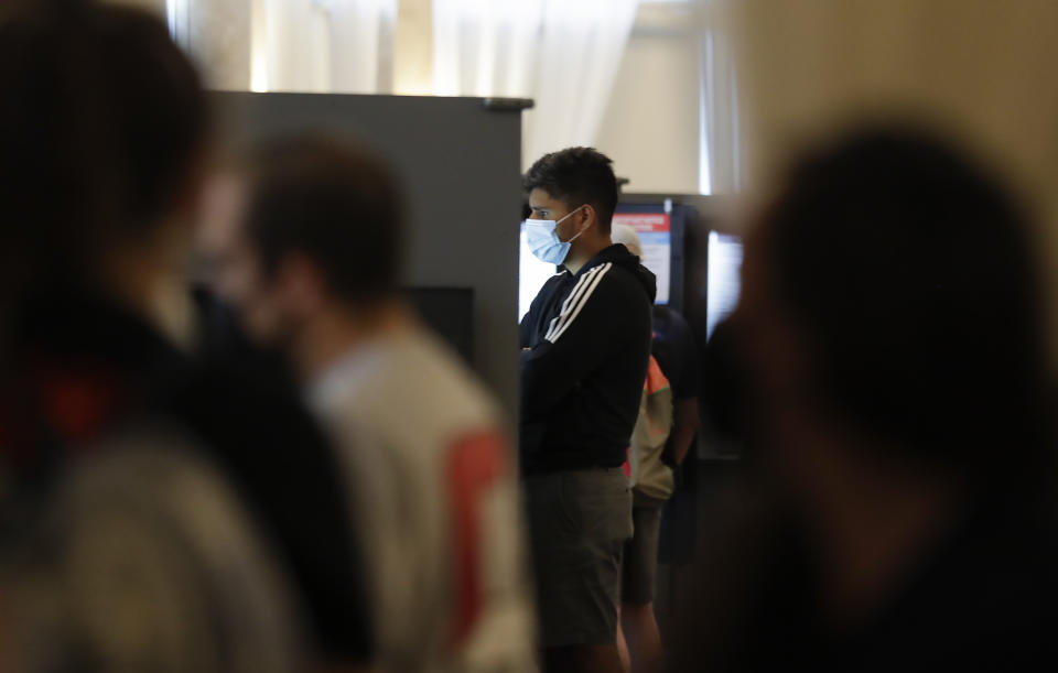 A person votes in the Georgia's primary election at Park Tavern on Tuesday, June 9, 2020, in Atlanta. (AP Photo/Brynn Anderson)