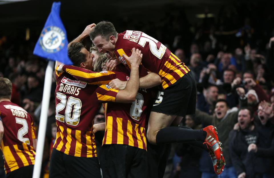 Bradford City's Andy Halliday (R) celebrates with team mates after Filipe Morais (20) scored against Chelsea during their FA Cup fourth round soccer match at Stamford Bridge in London January 24, 2015. REUTERS/Stefan Wermuth (BRITAIN - Tags: SPORT SOCCER)