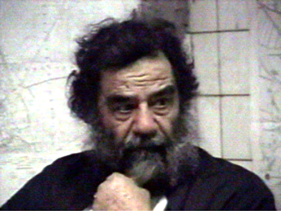 Saddam Hussein is filmed after his capture in this footage released December 14, 2003. U.S. troops captured Saddam Hussein near his home town of Tikrit announced U.S. administrator in Iraq Paul Bremer on Sunday, in a major coup for Washington's beleaguered occupation force in Iraq. REUTERS/Handout CRB
