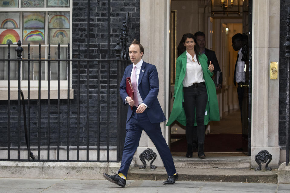 LONDON, ENGLAND  - MAY 01: Health Secretary Matt Hancock leaves 10 Downing Street with aide Gina Coladangelo after the daily press briefing on May 01, 2020 in London, England. Mr Hancock announced that the government's pledge to conduct 100,000 Covid-19 tests per day had been successful. British Prime Minister Boris Johnson, who returned to Downing Street this week after recovering from Covid-19, said the country needed to continue its lockdown measures to avoid a second spike in infections. (Photo by Dan Kitwood/Getty Images)