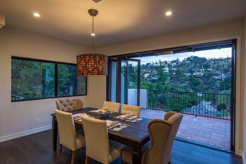 <p>The dining area boasts a beautiful vista. (Zillow) </p>