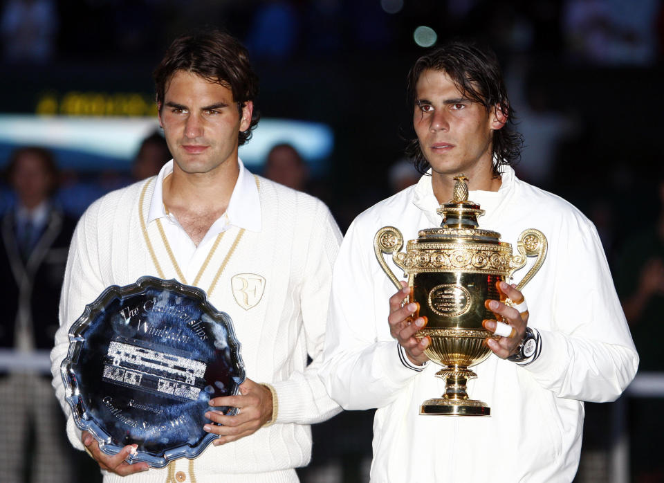 Spain's Rafael Nadal (right) and Switzerland's Roger Federer with their trophies following the Men's Final during the Wimbledon Championships 2008 at the All England Tennis Club in Wimbledon.   (Photo by Sean Dempsey - PA Images/PA Images via Getty Images)