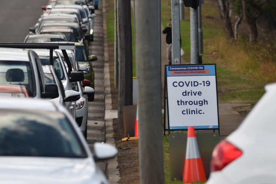 People queue up in their vehicles for a COVID test in NSW. Source: Getty