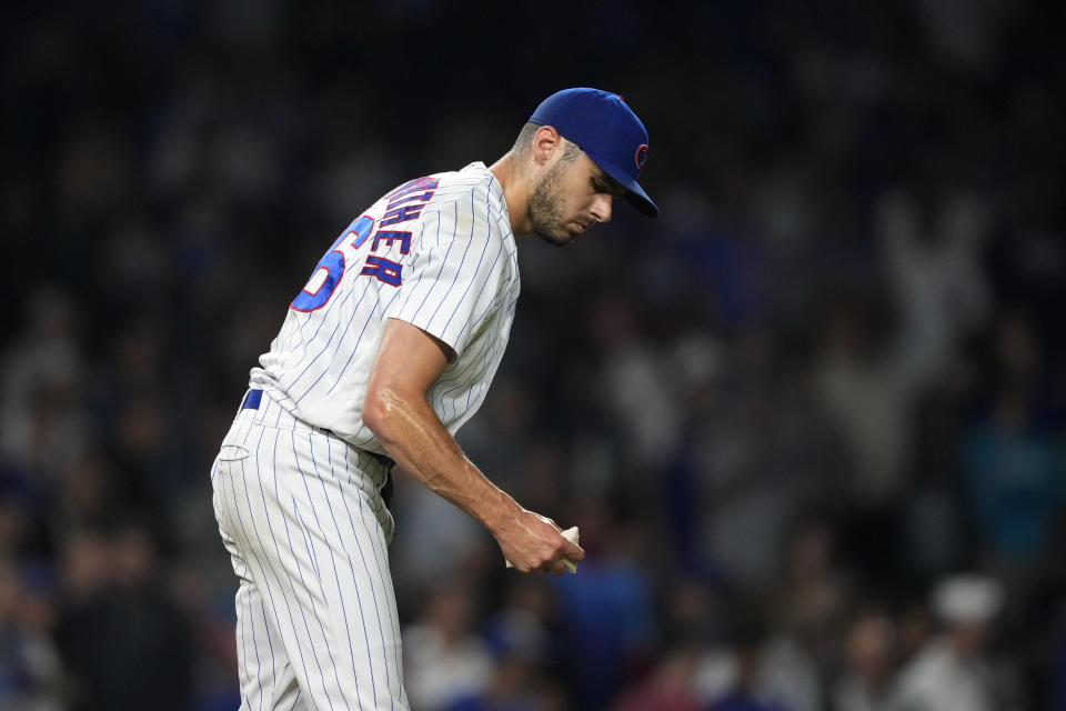 Chicago Cubs relief pitcher Julian Merryweather goes to the rosin bag after giving up a pinch-hit, three-run home run to Pittsburgh Pirates' Joshua Palacios during the ninth inning of a baseball game Thursday, Sept. 21, 2023, in Chicago. (AP Photo/Charles Rex Arbogast)