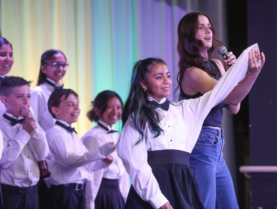 American Idol finalist and former student Abi Carter spends time with the George Washington Charter School choir in Palm Desert, Calif., May 14, 2024.