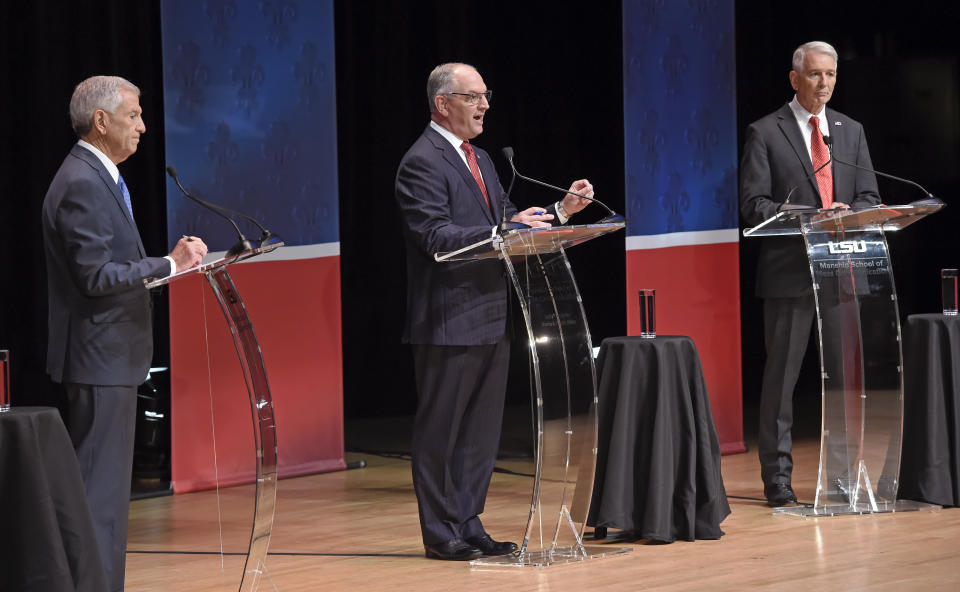 From left, Eddie Rispone, Gov. John Bel Edwards and Republican Rep. Ralph Abraham participate in the first televised gubernatorial debate Thursday Sept. 19, 2019, in Baton Rouge, La. (Bill Feig/The Advocate via AP, Pool)