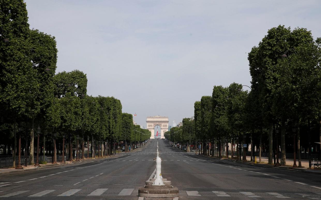 The empty Champs Elysee avenue empty again - AP Photo/Francois Mori