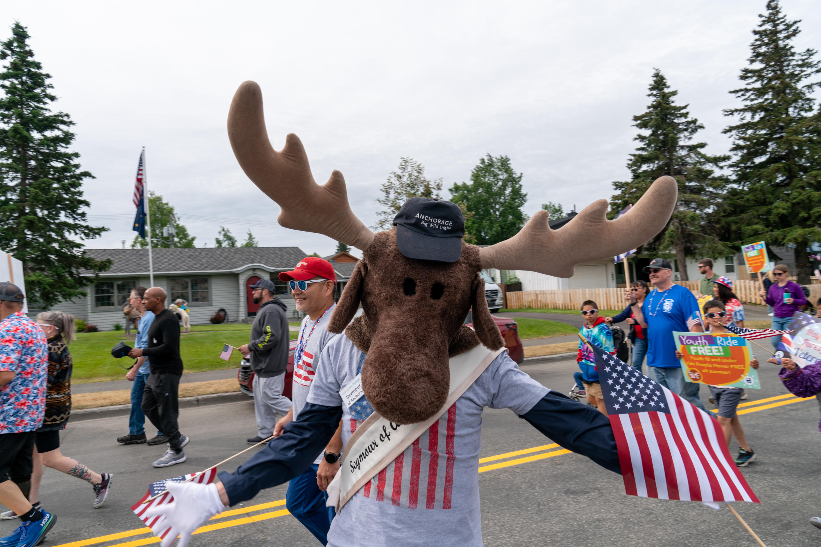 A person dressed up in a moose costume at a Fourth of July parade in Anchorage, Alaska.