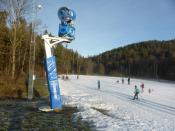 Cross-country skiers practice on artificial snow in a forest in Oslo