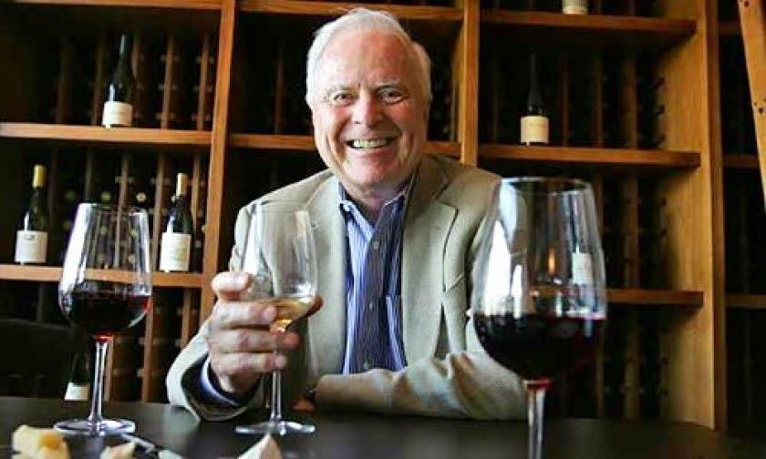 Former L.A. Mayor Richard Riordan samples wine at one of his restaurants.