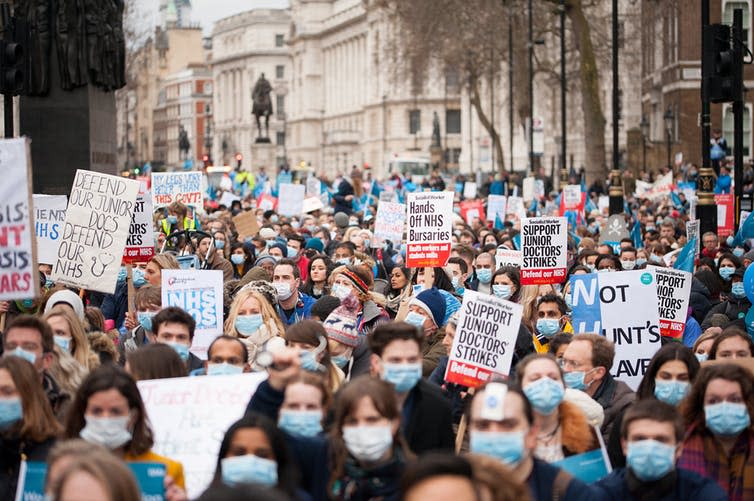 <span class="caption">Protests against government plans to change NHS junior doctor contracts.</span> <span class="attribution"><a class="link " href="https://www.shutterstock.com/image-photo/downing-street-london-uk-6th-february-388521463?src=QA3QkPYmUB9wipkS2z3iBg-1-4" rel="nofollow noopener" target="_blank" data-ylk="slk:Shutterstock;elm:context_link;itc:0;sec:content-canvas">Shutterstock</a></span>