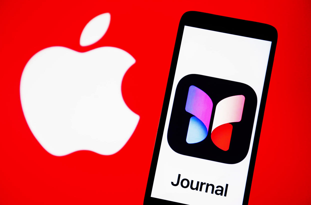 In this photo illustration, logo of a journaling app for iOS is seen on a smartphone along with Apple logo
