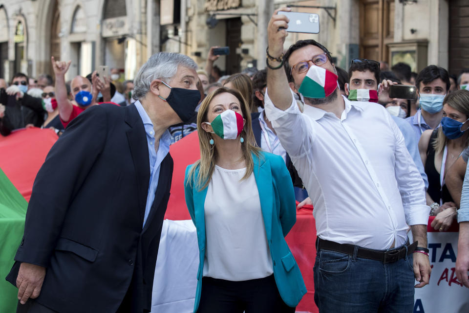 From left, Forza Italia party's Antonio Tajani, Brothers of Italy Party's leader Giorgia Meloni and The League party leader Matteo Salvini take a selfie during an anti-government protest in Rome, Tuesday, June 2, 2020 on the day marking the 74th anniversary of the Italian Republic. (Roberto Monaldo/LaPresse via AP)