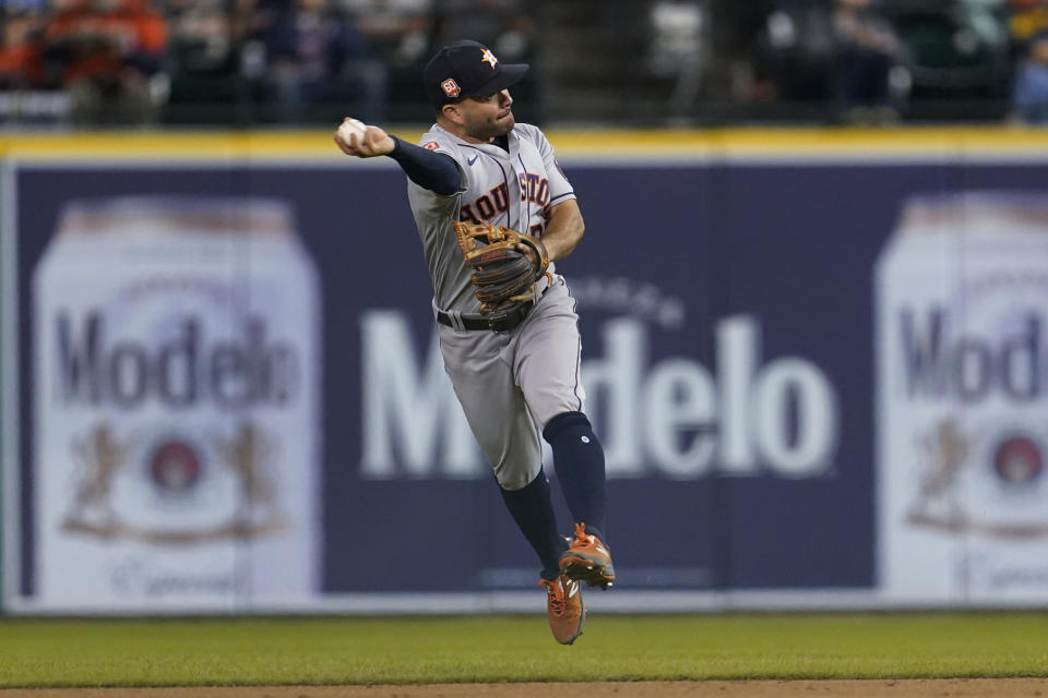 Houston Astros second baseman Jose Altuve throws Detroit Tigers' Harold Castro out at first base in the fifth inning of a baseball game in Detroit, Tuesday, Sept. 13, 2022. (AP Photo/Paul Sancya)